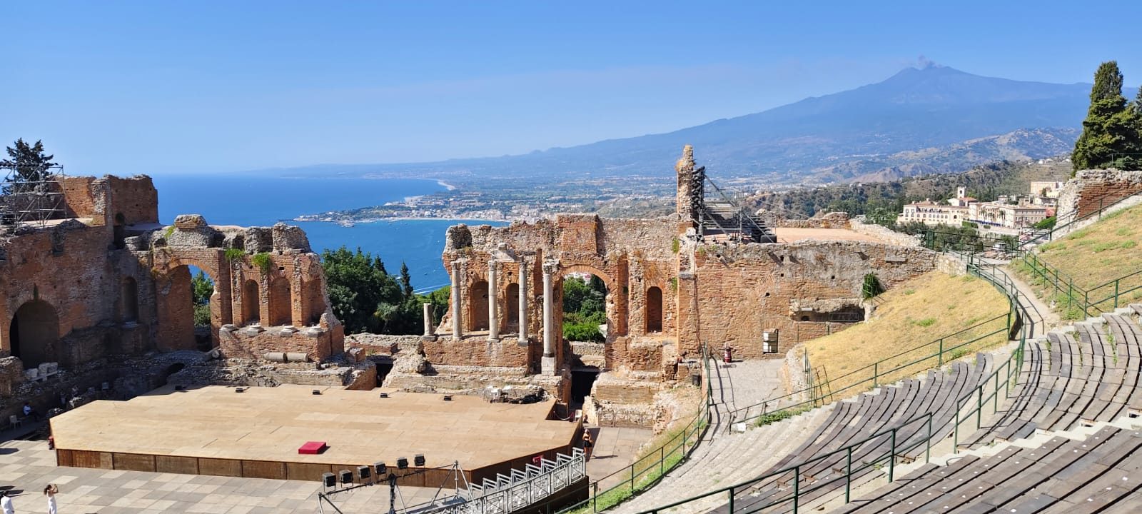 The ancient theater of Taormina, with Mount Etna and the sea beyond